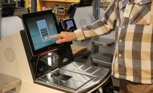 A person using a self checkout