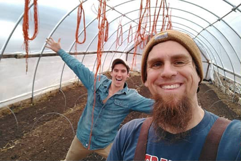 David Bachhuber and crew of Lovefood Farm posing in a greenhouse