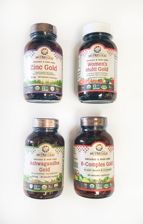 Four bottles of Nutrigold vitamin supplements