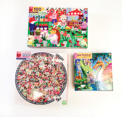 Three boxes of jigsaw puzzles