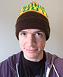 color headshot of Robert Halstead wearing a black and yellow beanie