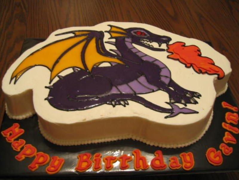 A birthday cake with a medieval dragon on it