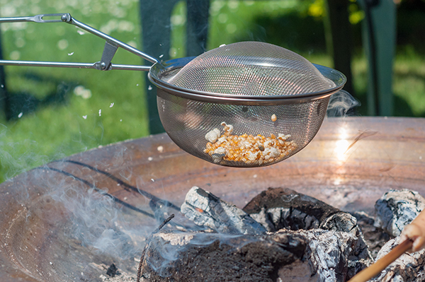 Popcorn over open fire on a warm day