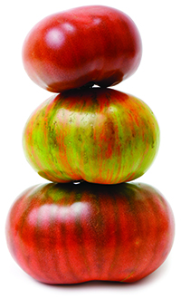 Three Heirloom tomatoes stacked on top of each other