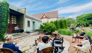 people gathered listening to music at the Rain Garden