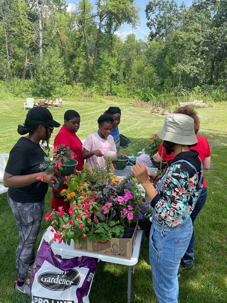 A group of students during a flower workshop. 