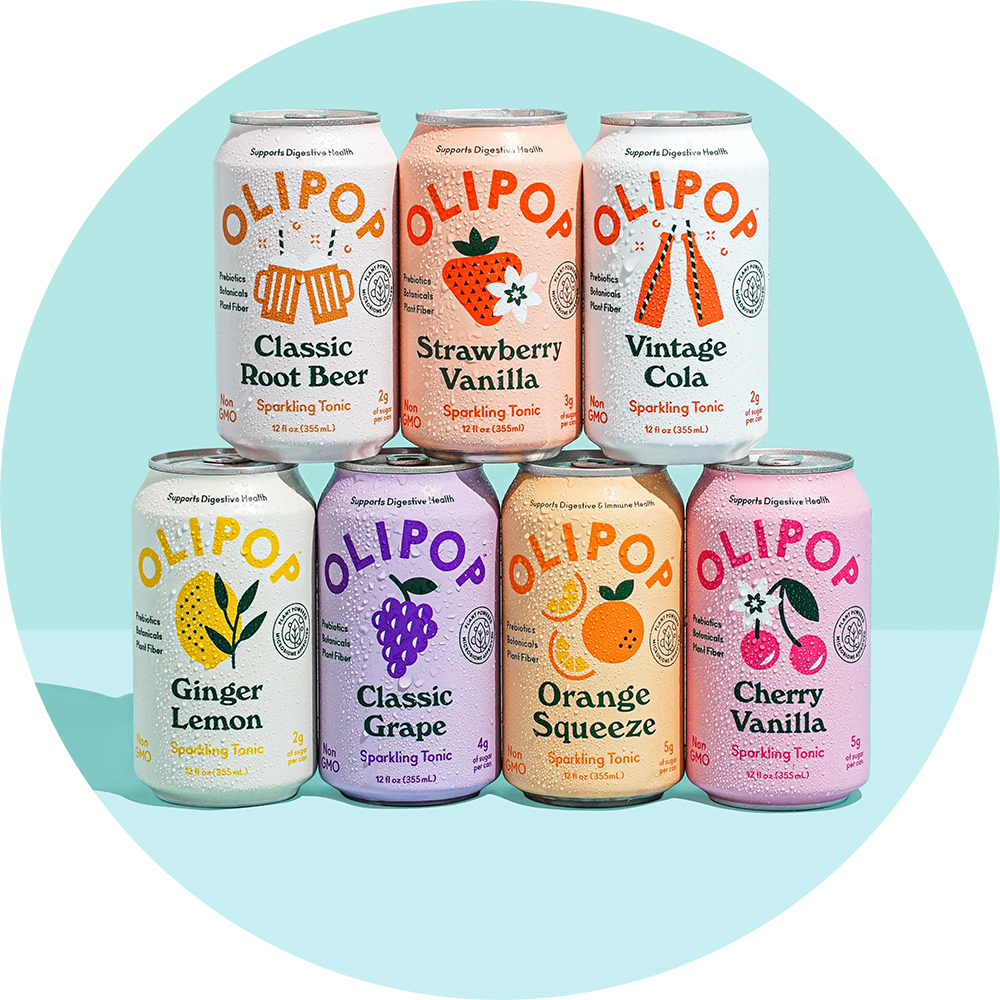 Seven Olipop soda cans featuring all seven flavors: Classic Root Beer, Strawberry Vanilla, Vintage Cola, Ginger Lemon, Classic Grape, Orange Squeeze, Cherry Vanilla