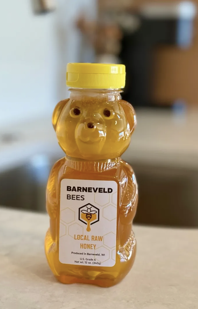 A bear shaped bottle of honey